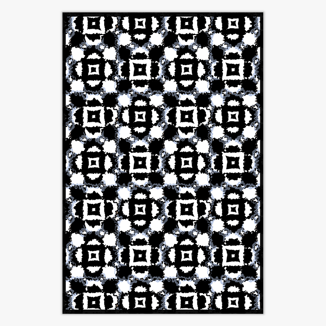 photo of a black and white floral pattern rug against a off white background