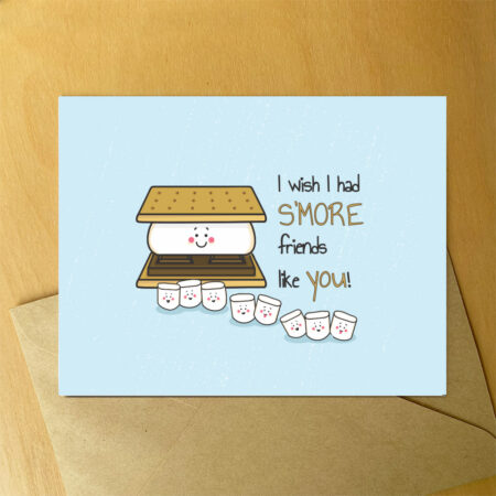A photo of a blue card on an envelope with an illustration of a smiling smore surrounded by smiling mini marshmallows.