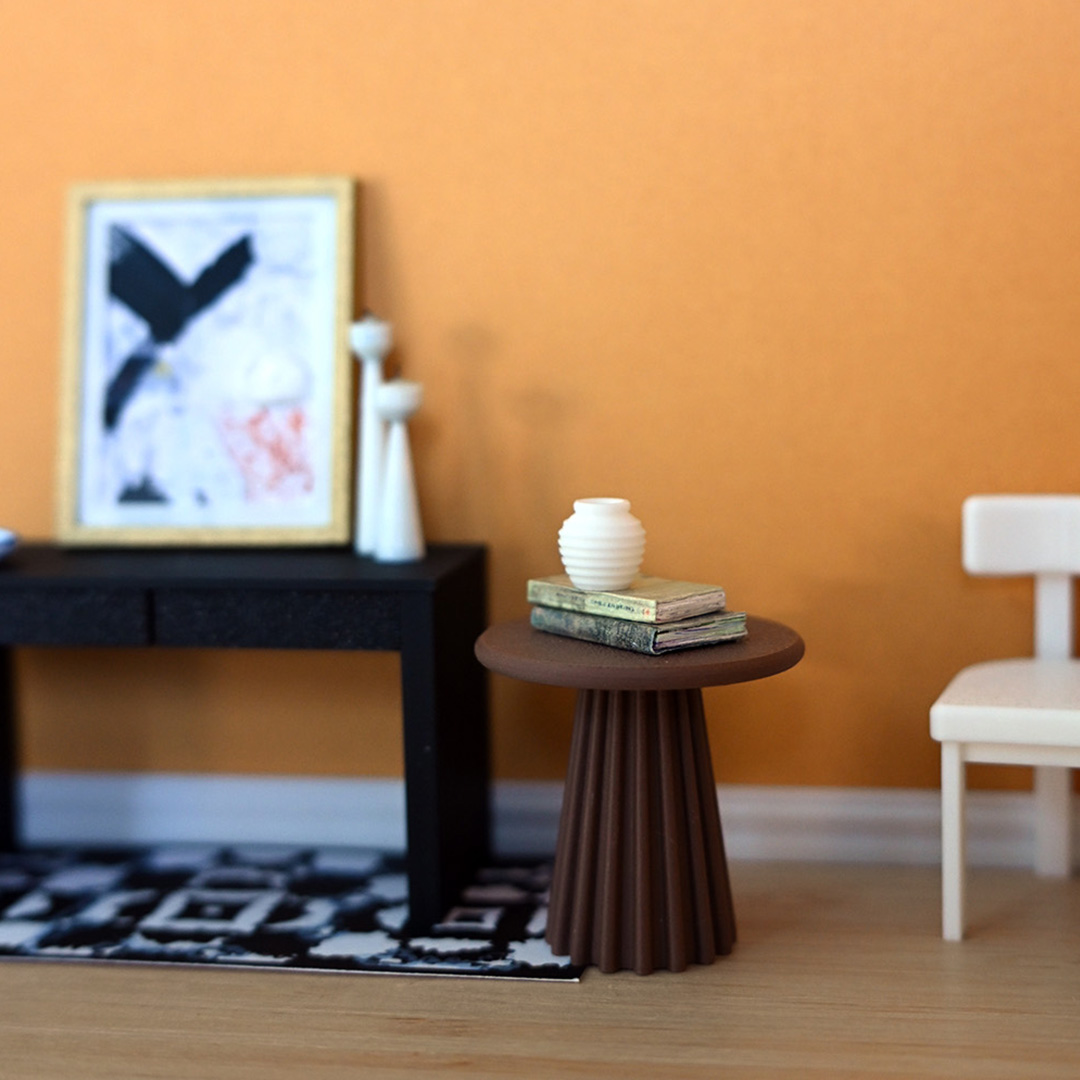 a scene with a orange background and multiple pieces of 3d printed mini furniture