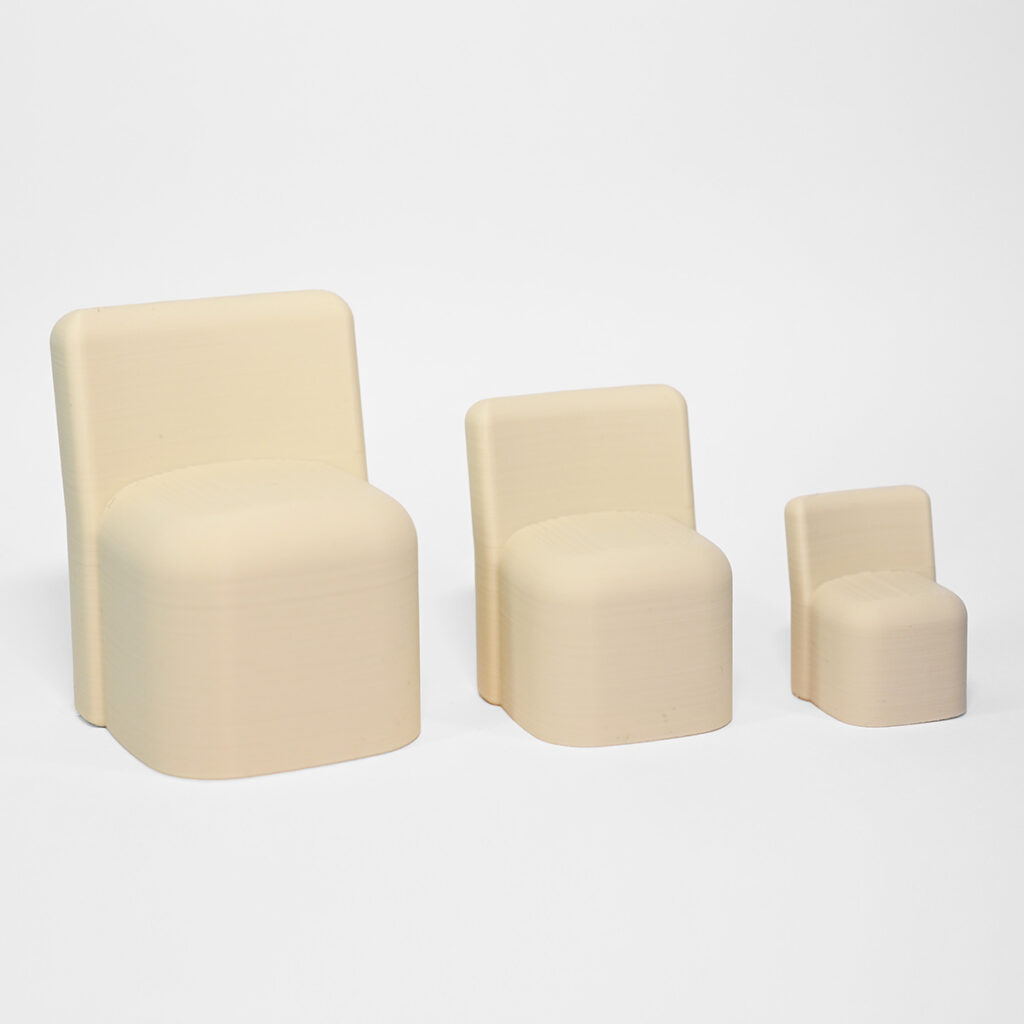 A set of three sizes of mini side chairs printed in whit