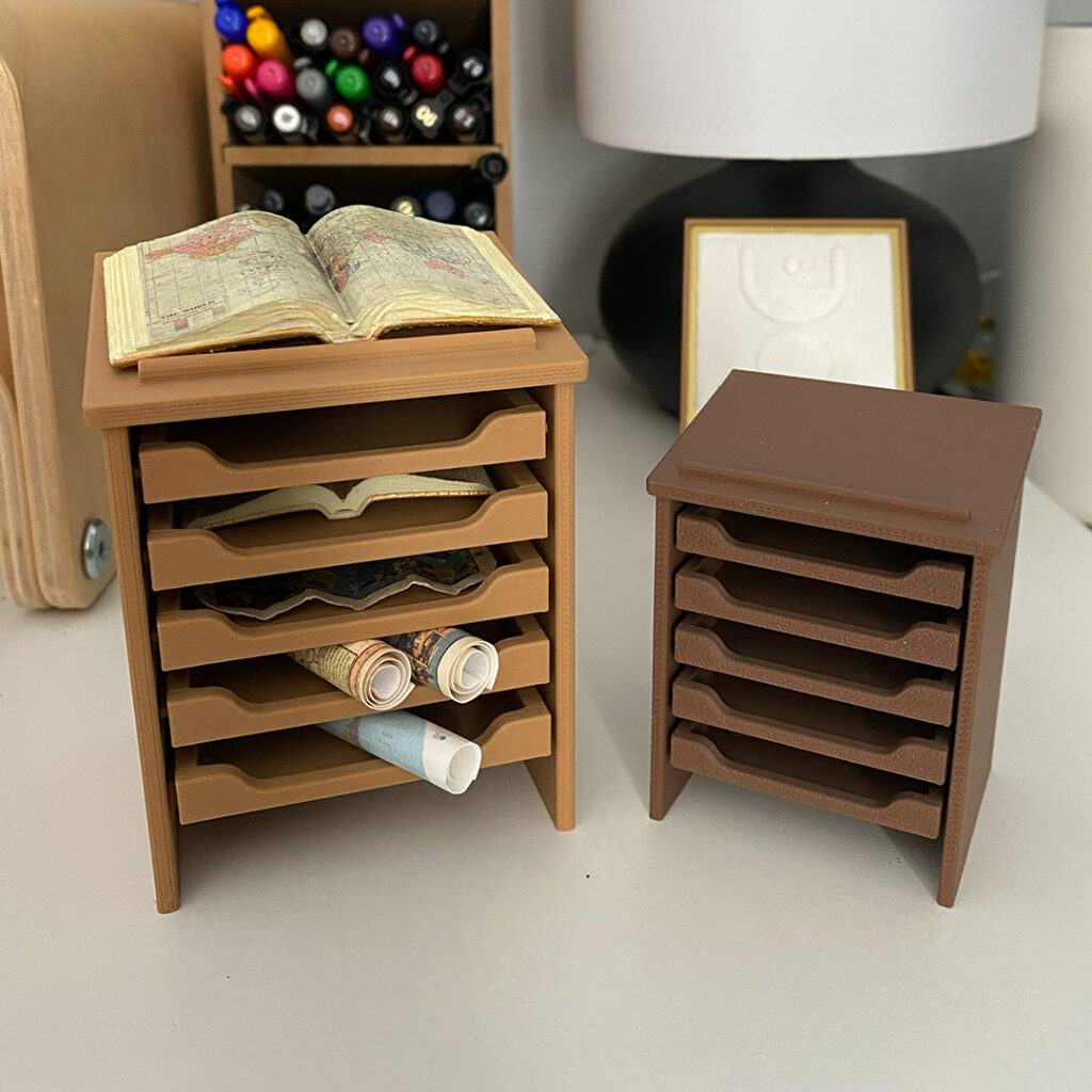 Mini atlas stands on a real desk