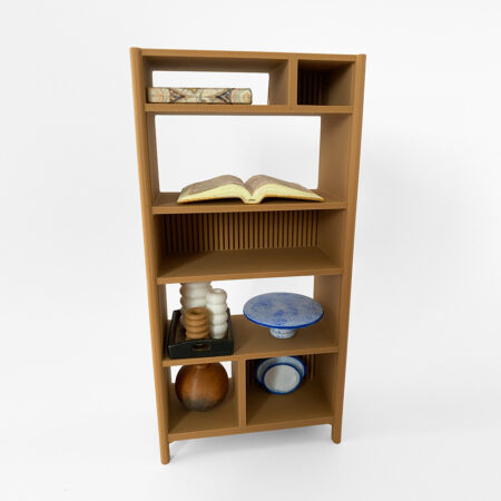 A mini bookcase filled with mini home decor items