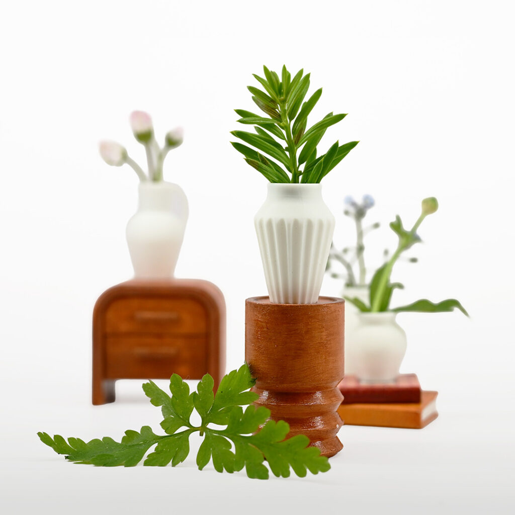 Tiny vases with greenery