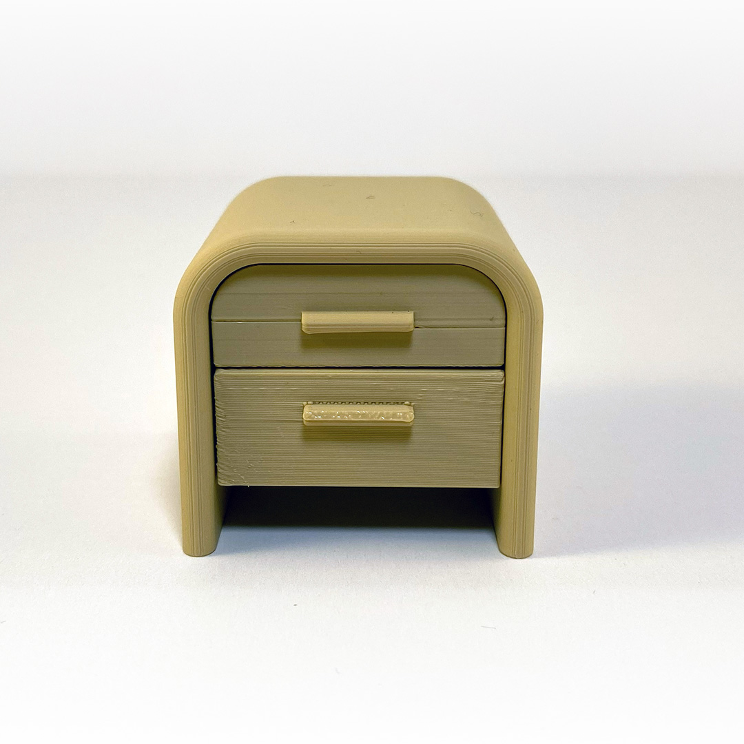 photo of a tiny nightstand with a curved frame