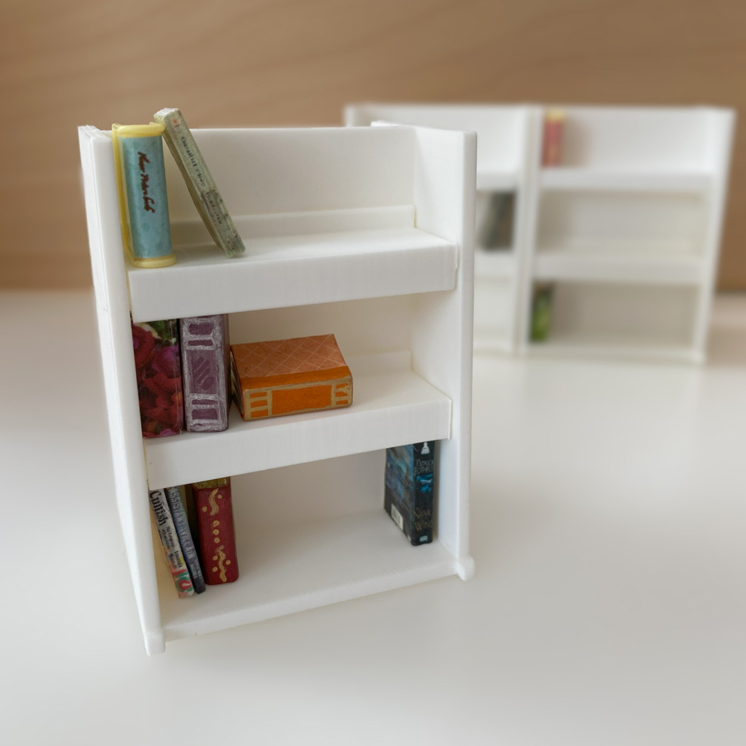 a photo of a tiny bookshelf with tiny books