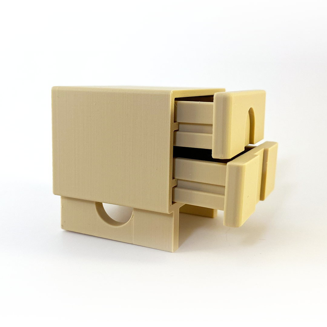 photo of a beige miniature nightstand, side view