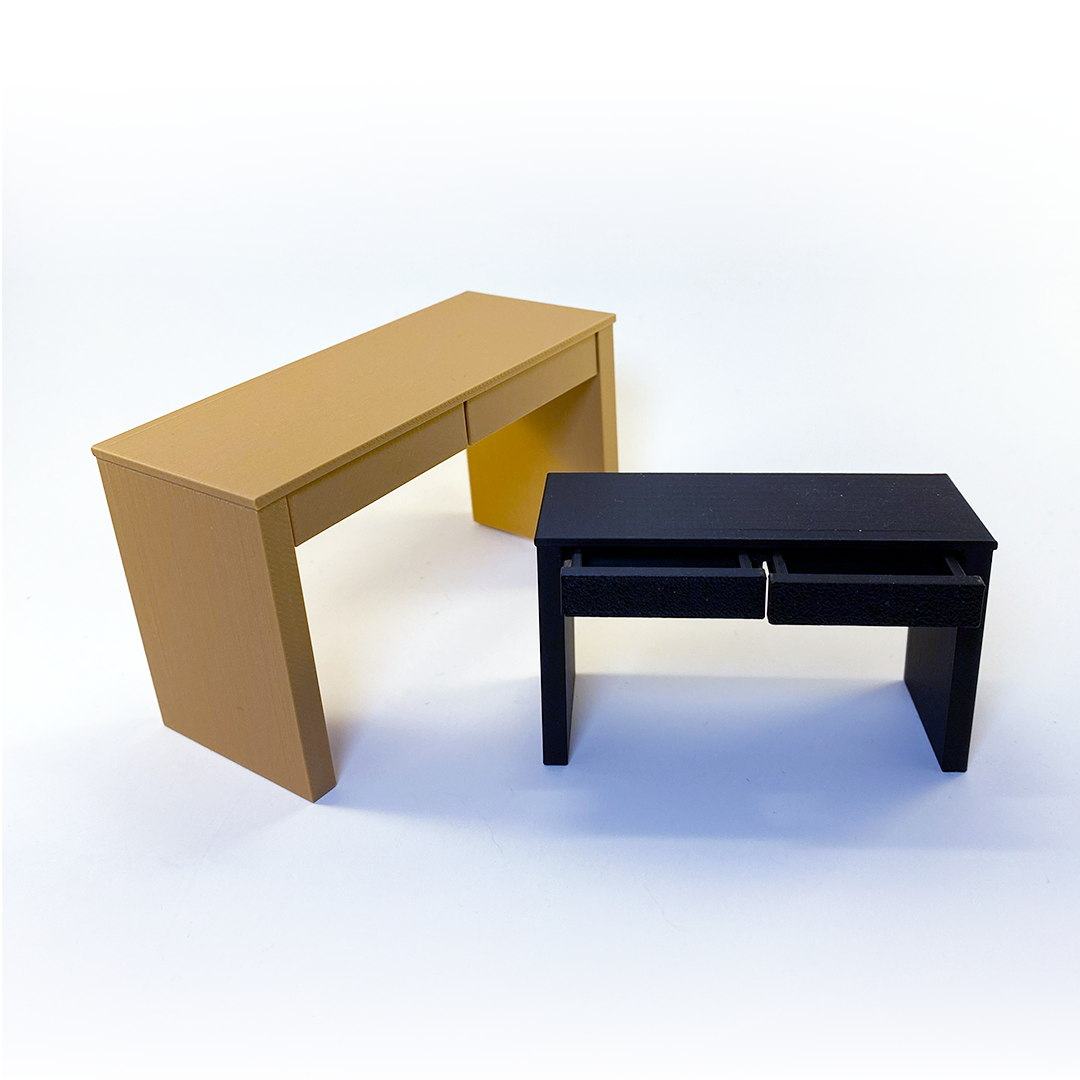 a photo of two miniature desks in two different sizes, one beige and one black