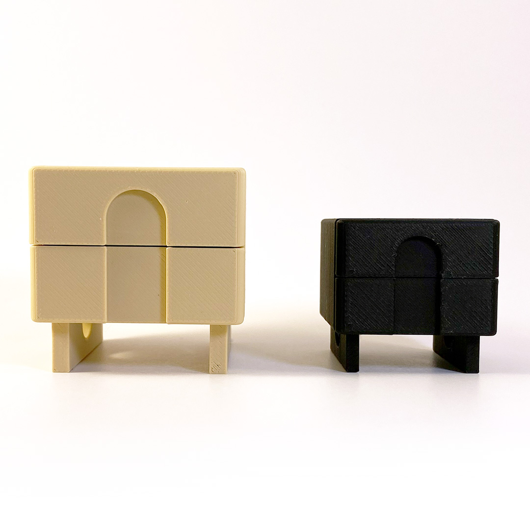 photo of twominiature nightstands in beige and black
